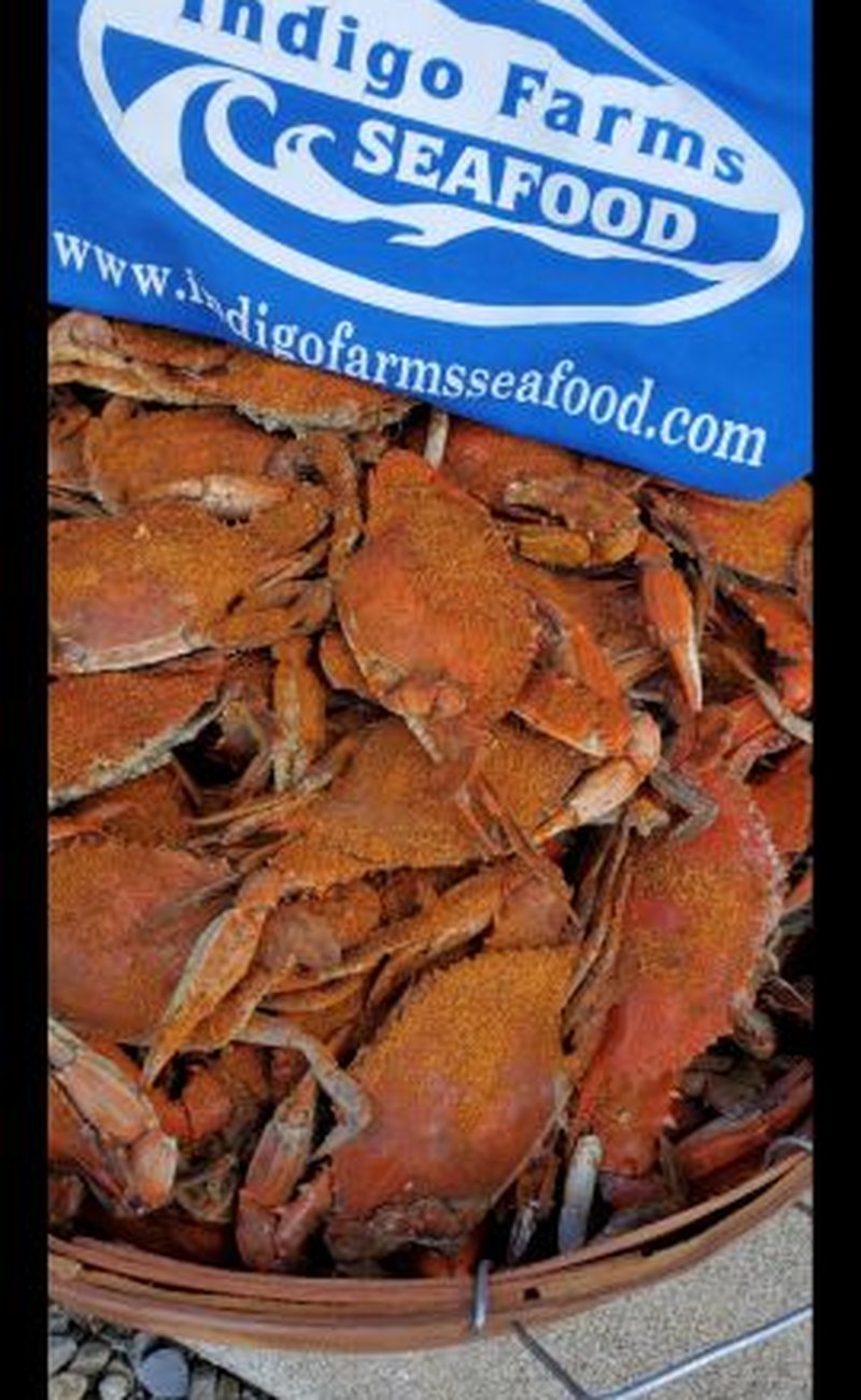 Fresh steamed crabs with Indigo Farms banner